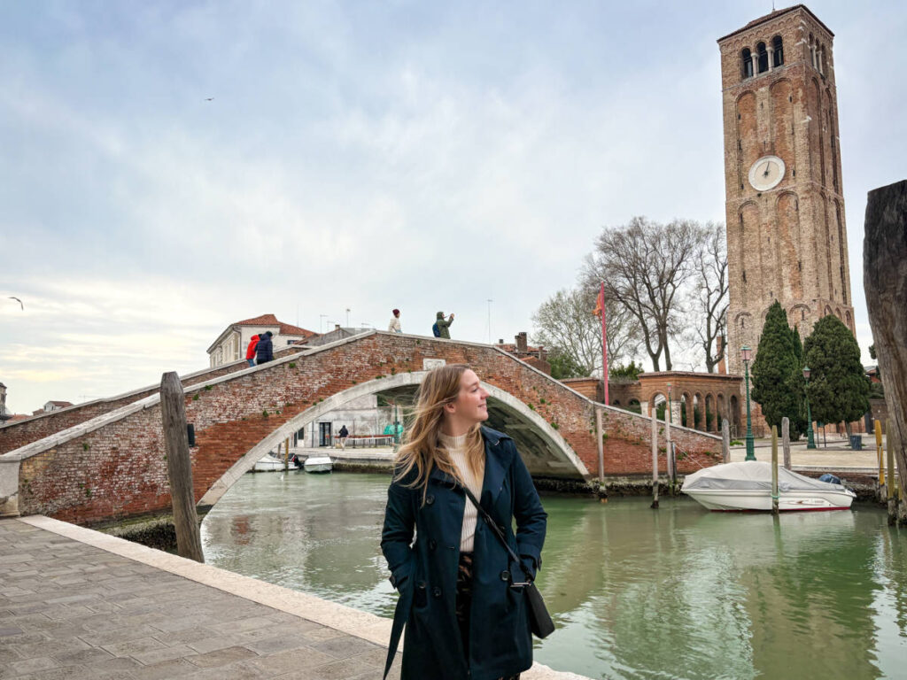 The author Taylor Herperger, enjoying the views of the bridge and the clock tower of Murano