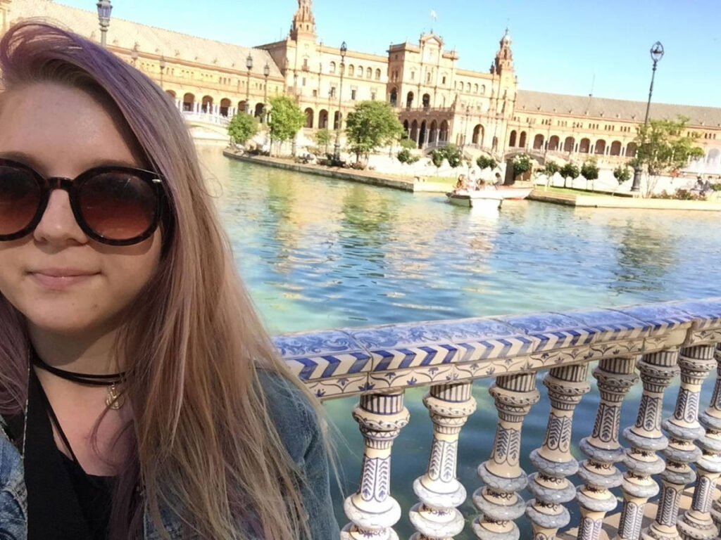 The author Taylor Herperger smiling for a selfie during her visit in Seville