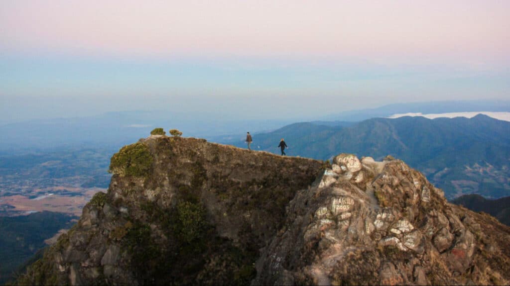 The author Taylor Herperger and a man on Volcan Baru in Panama seen from a distance