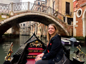The author Taylor Herperger, smiling for a photo while on the gondola