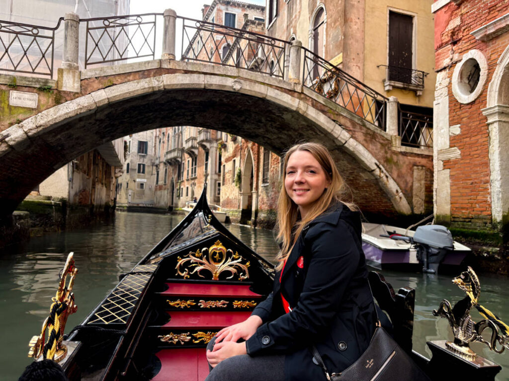 The author Taylor Herperger, riding the iconic gondola in Venice