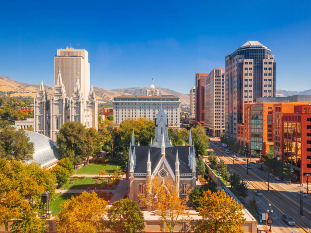 Cityscape over Temple Square with autumn foliage around