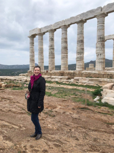 The author, Rebecca Halls smiling for a phot at the Temple of Poseidon