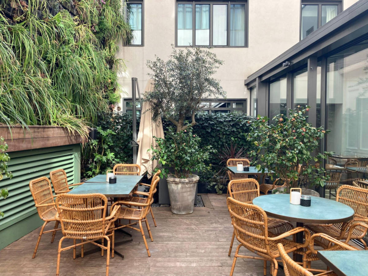 The tables and chairs at the terrace of Maison Breguet