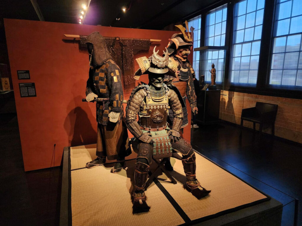 A display of Japanese samurai artifacts at The Ann & Gabriel Barbier-Mueller Museum