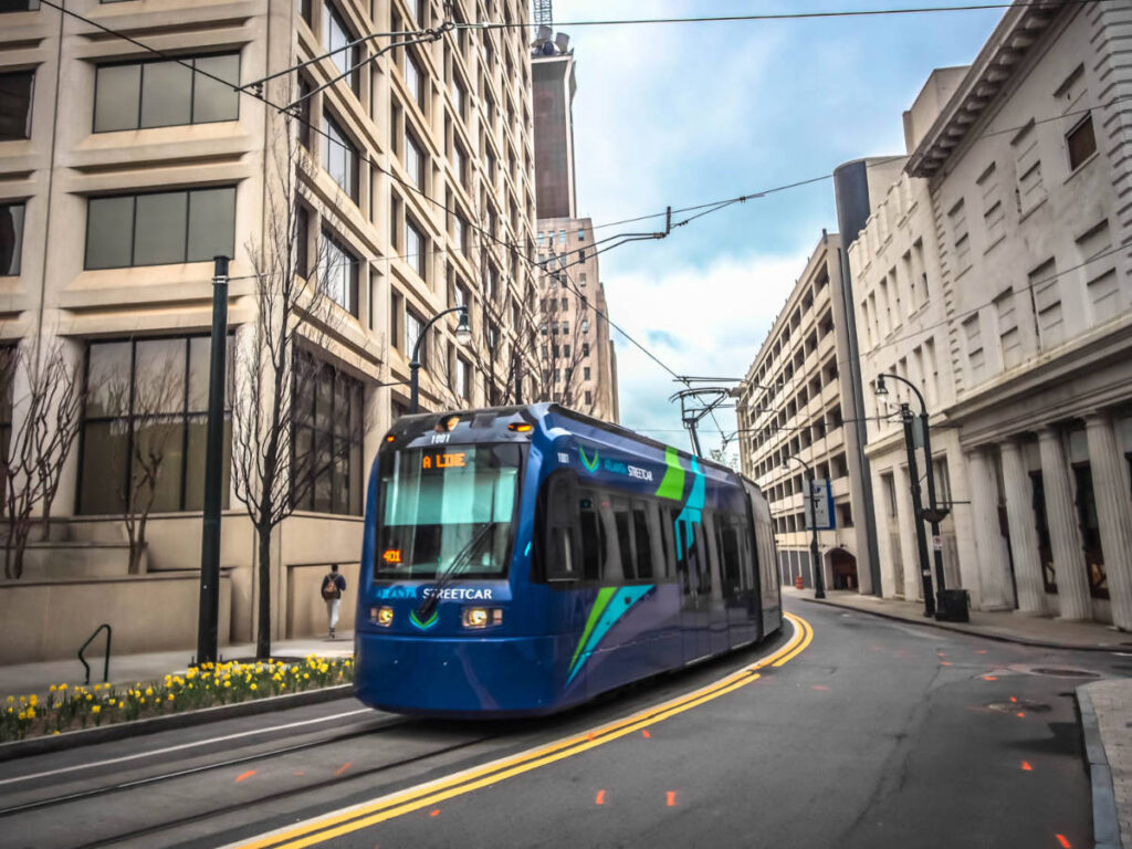View of the Atlanta Streetcar moving through Downtown on Auburn Aven