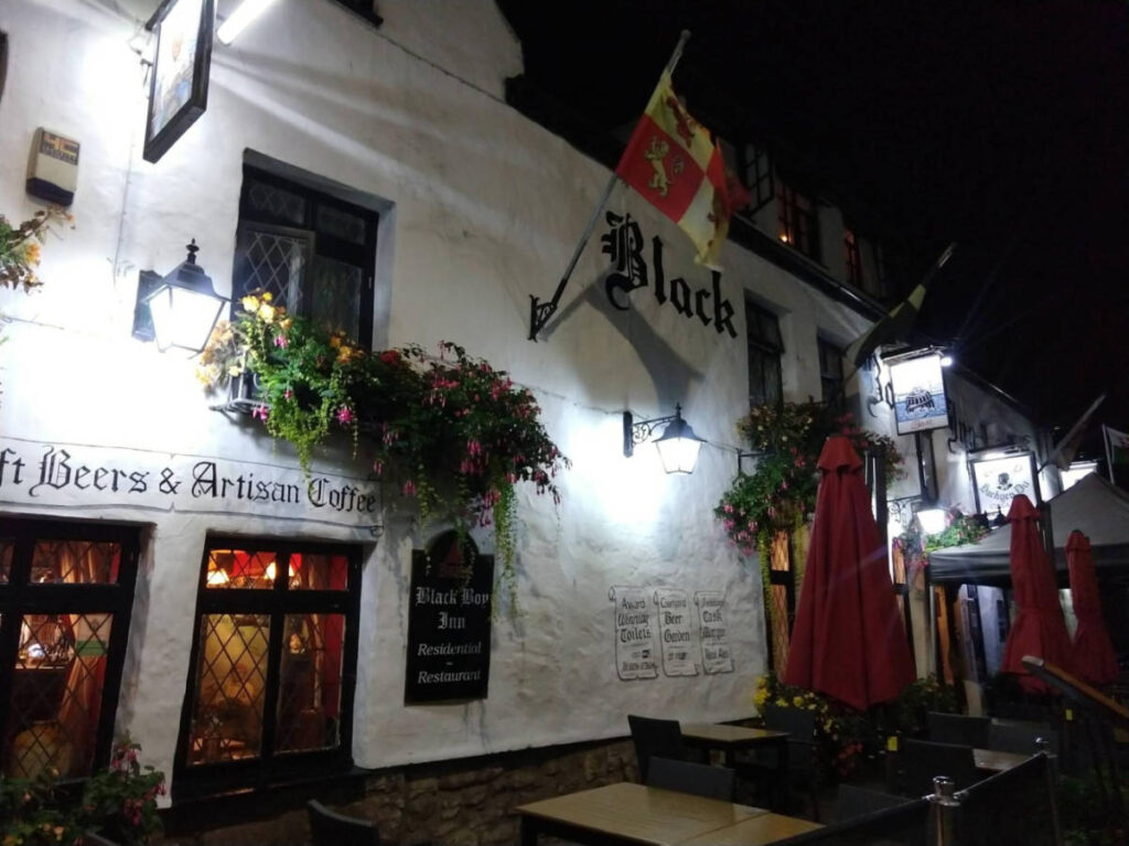 View outside The Black Boy Inn at night