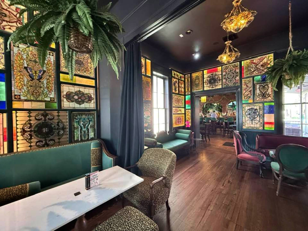 View of the stained glass windows and the cozy interior of The Bombay Bicycle Club