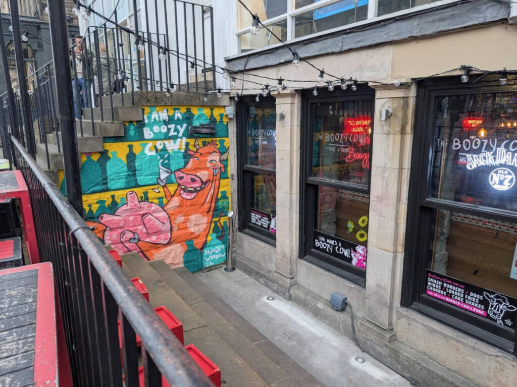 View of the colorful mural outside The Boozy Cow