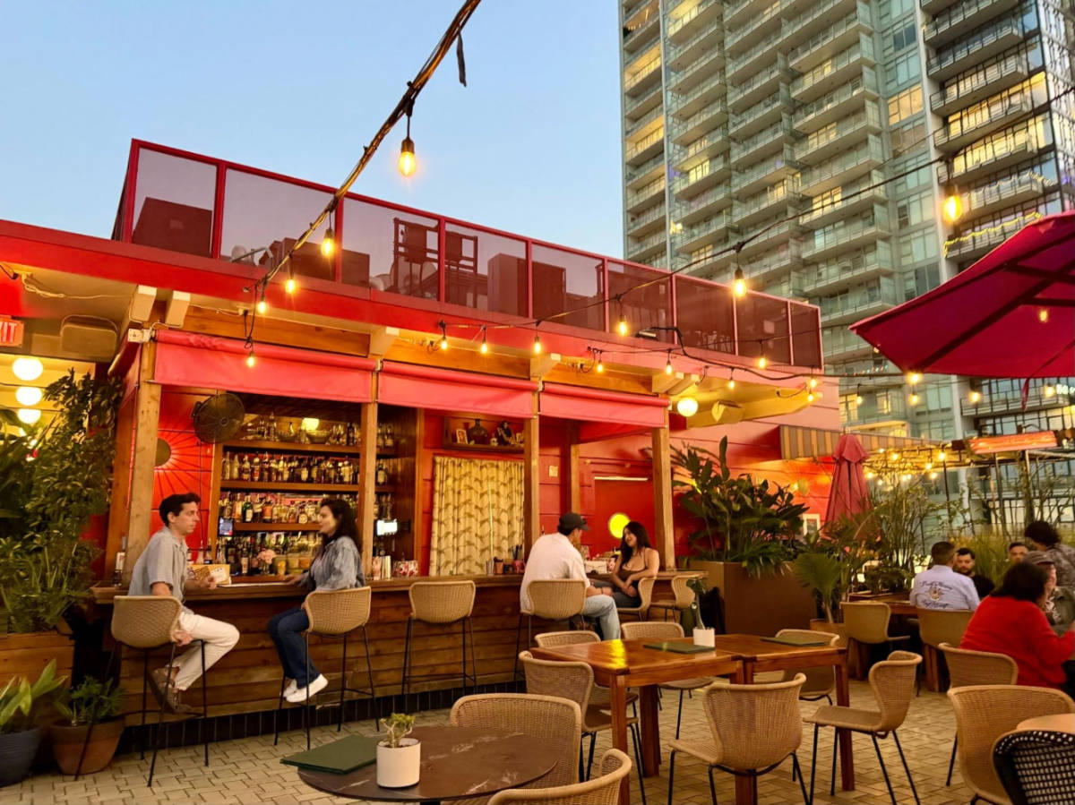 People dining and chilling at The Broken Shaker rooftop bar