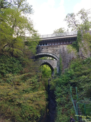 The Three Bridges surrounded by greenery at The Devil’s Bridge