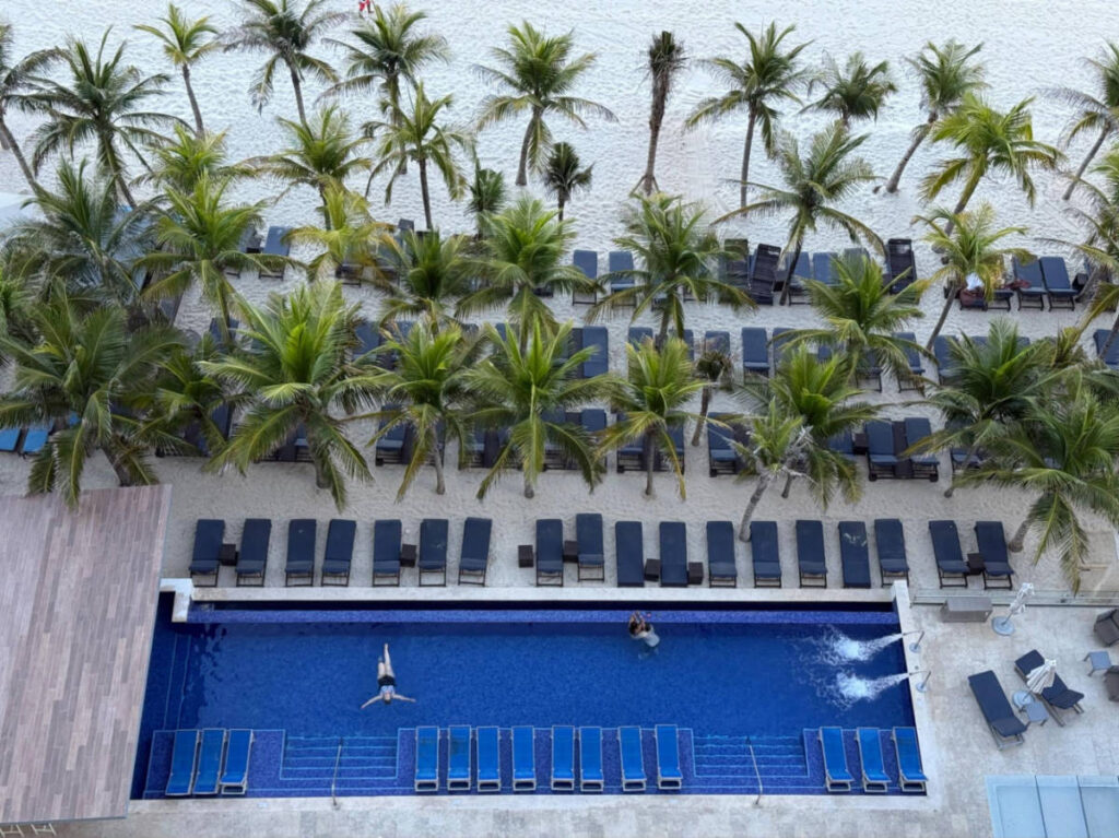 Aerial view of The Diamond Club Pool surrounded by tropical trees