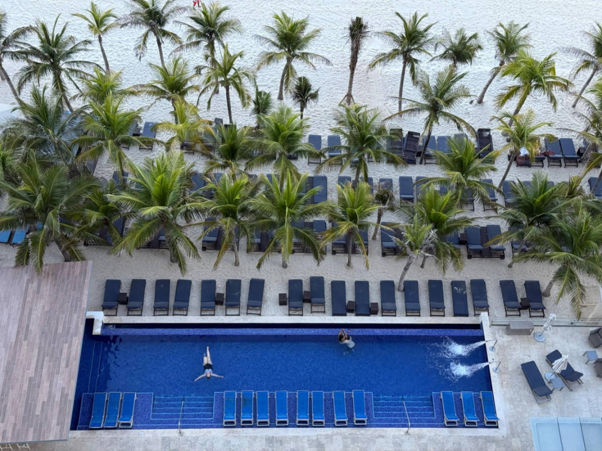Aerial view of The Diamond Club Pool surrounded by tropical trees