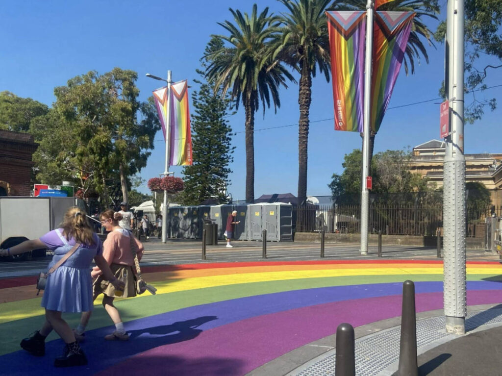 The rainbow pedestrian and flags around the Fabulous Wonder Mama