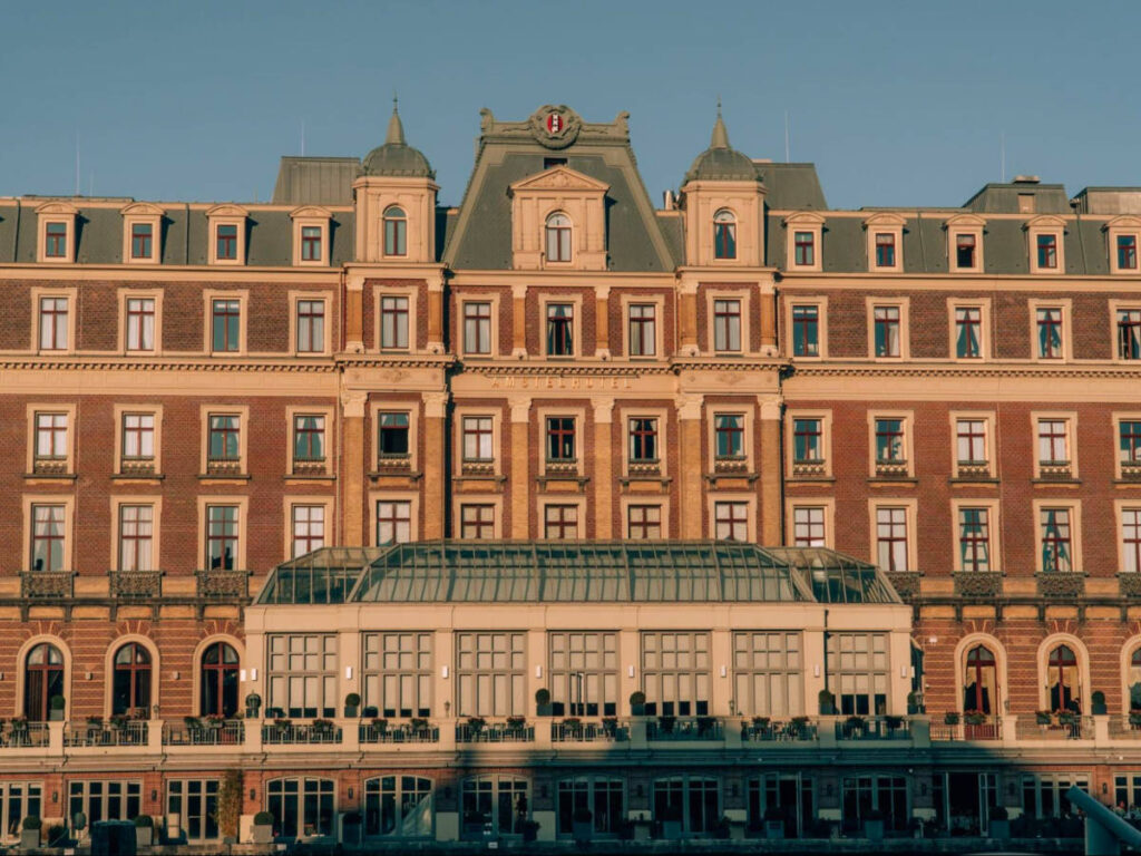 Facade of The InterContinental Amstel Hotel during sunset