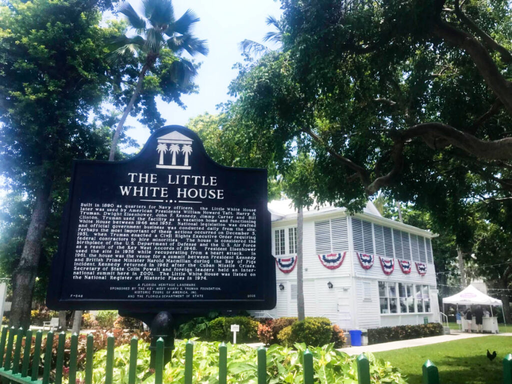 The signage of The Little White House from the outside