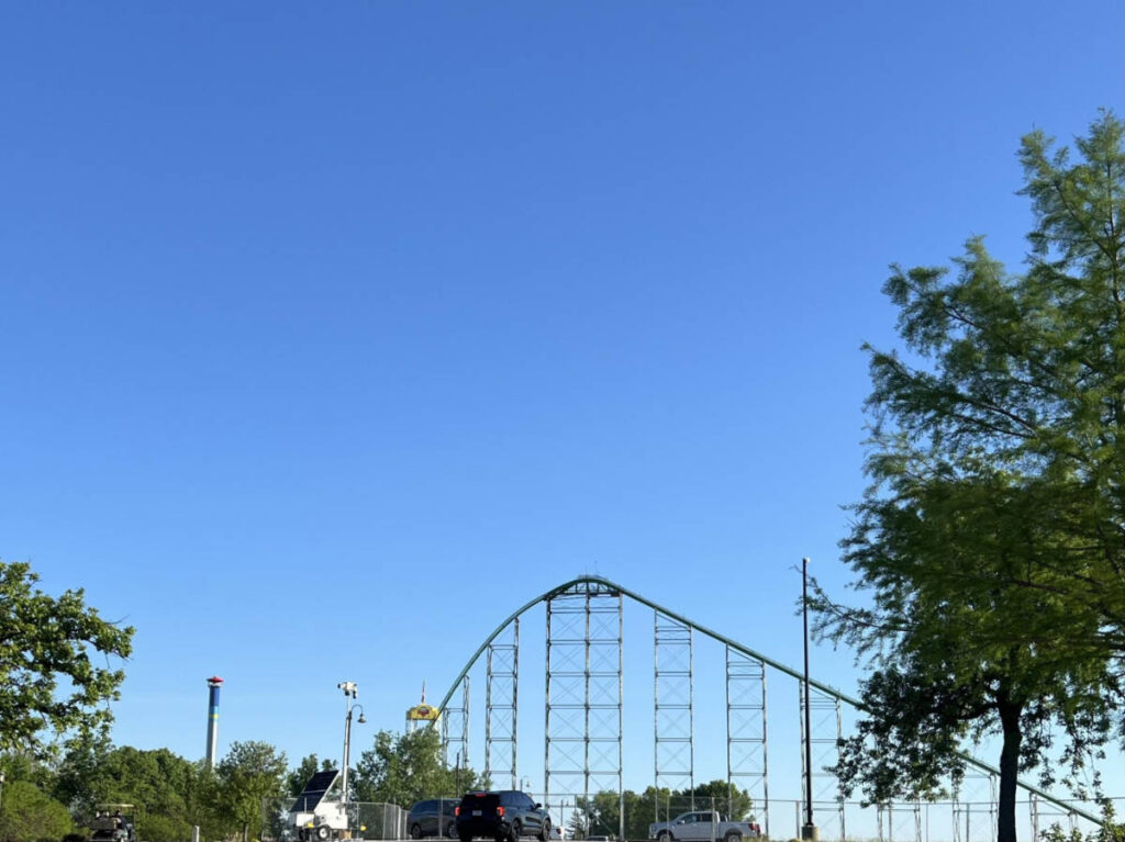 Perspective view of The Mamba and Detonator at Worlds of Fun against the clear blue sky