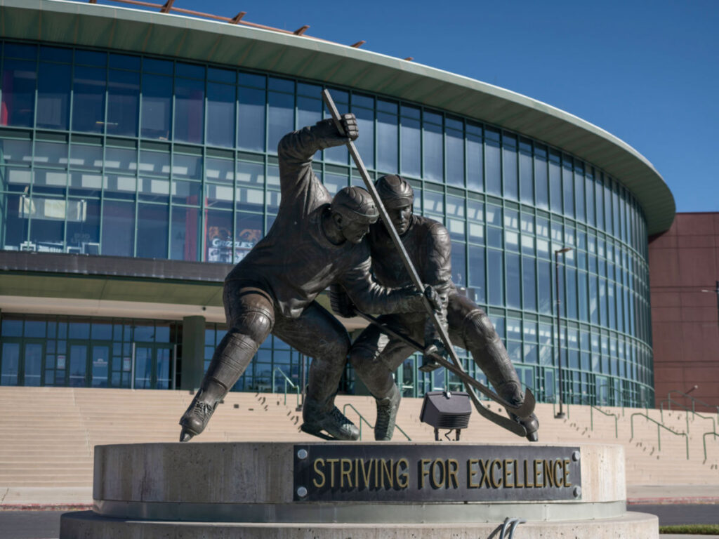 Ice hockey statue in front of The Maverik Center