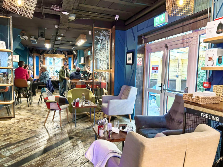 View of the colorful interior of the cafe of The Nest Boutique Hostel