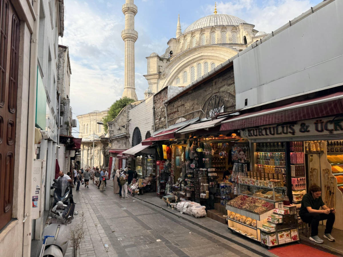 View of the Nuruosmaniye Mosque towers over the shops nearby