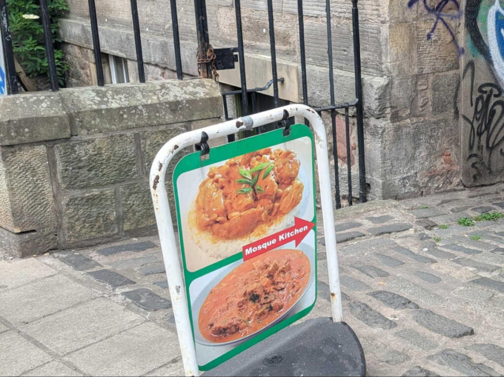 View of the signage pointing The Original Mosque Kitchen Signage