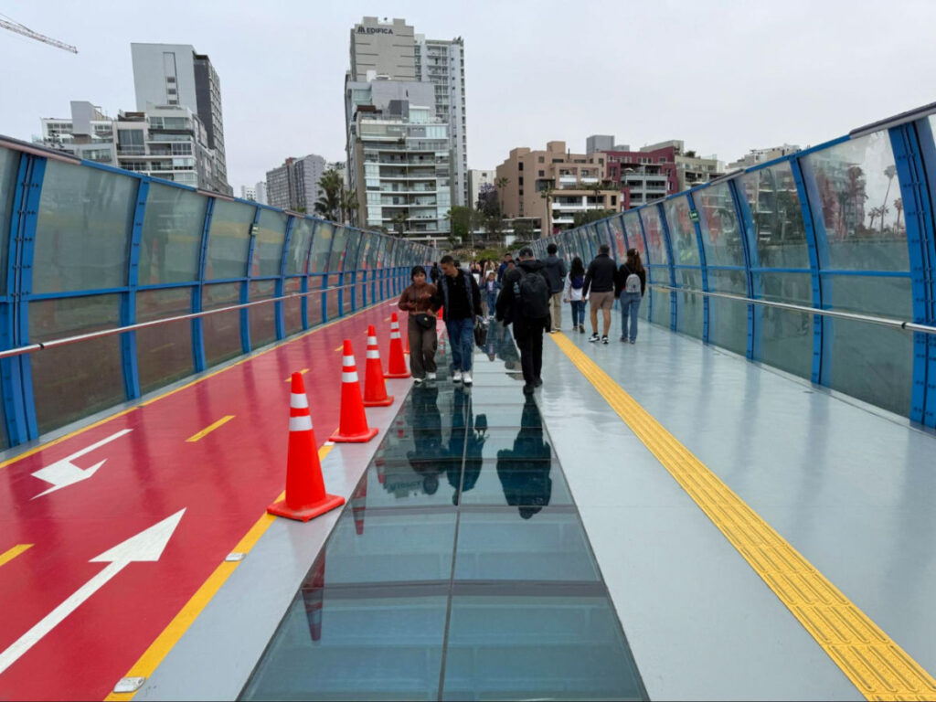 People walking on The Peace Bridge in Lima
