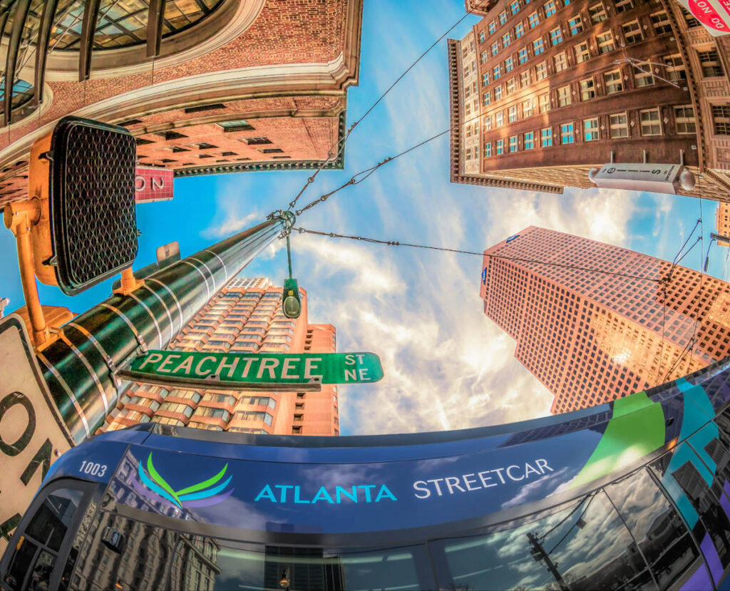 The Peachtree Street sign surrounded by buildings and the Streetcar