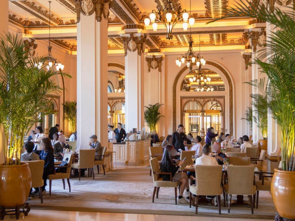 People dining inside The Peninsula Hotel
