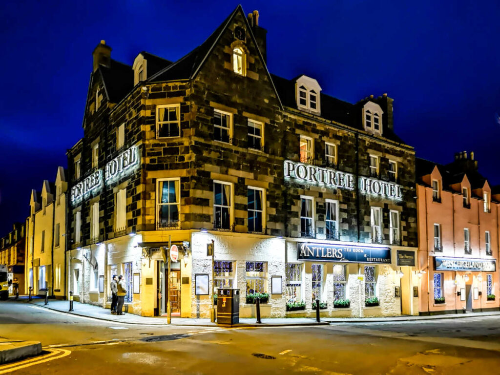 Exterior view of The Portree Hotel at night