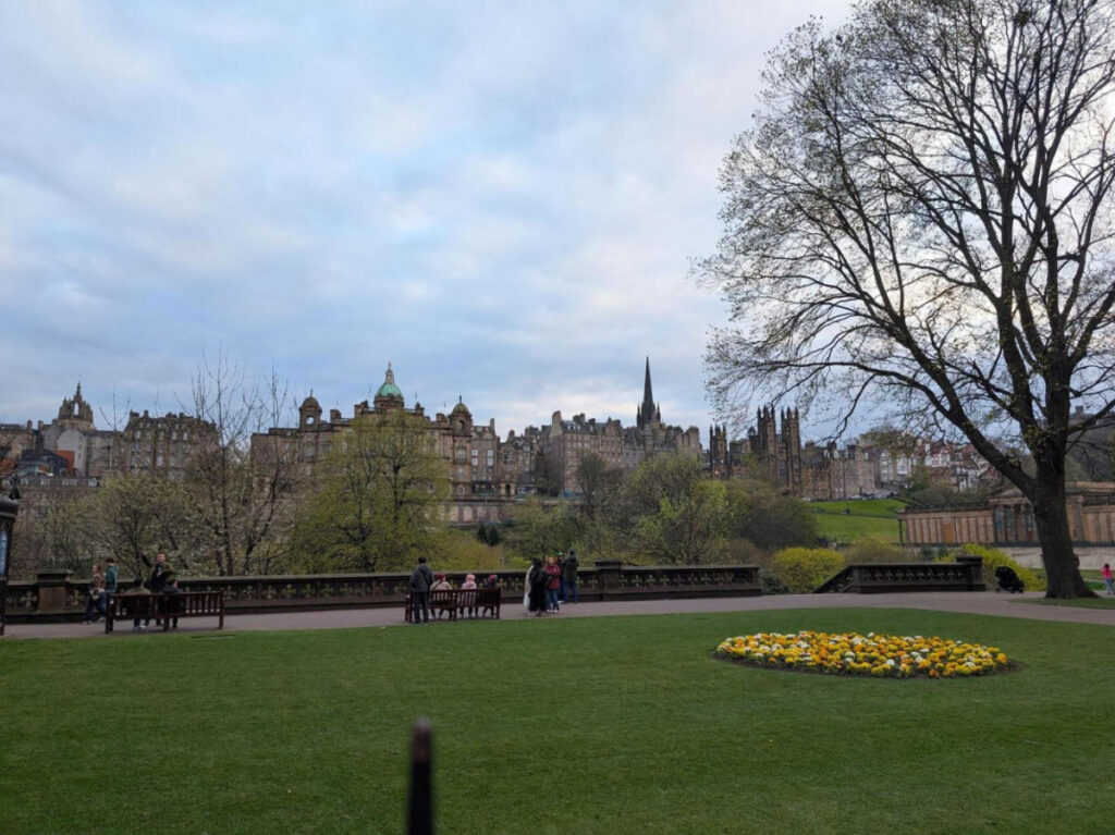 People relaxing at The Princes Street Gardens