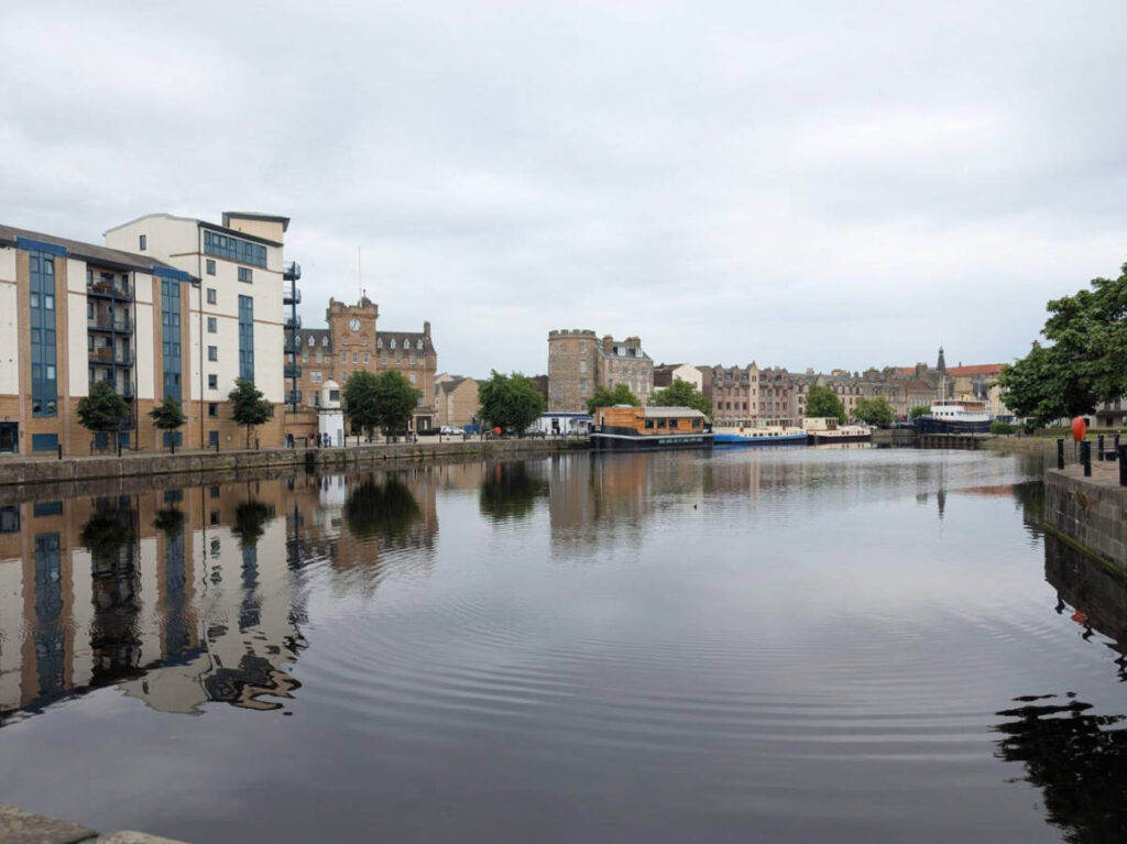 View of the buildings around the serene shore in Leith