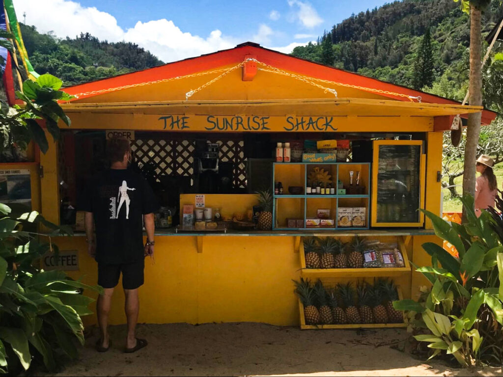 A man in front of The Sunrise Shack