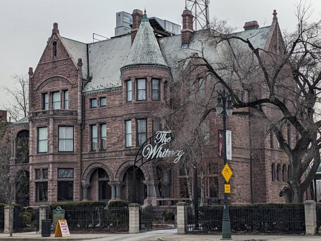 View of the Victorian exterior of The Whitney mansion