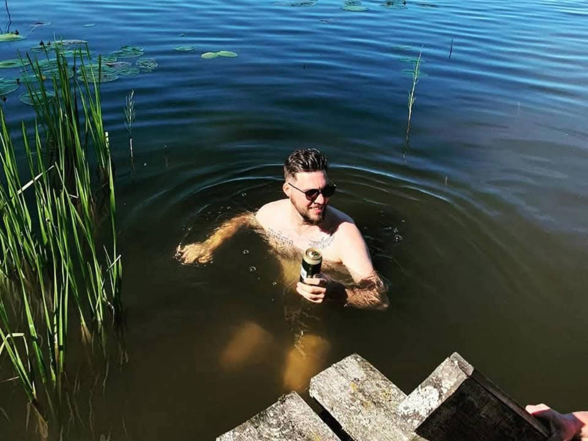 The author Thom Brown, swimming in a lake near Tartu