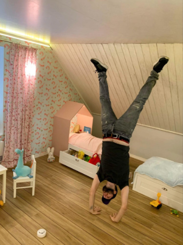 The author Thom Brown, turning upside down in a Upside-Down House