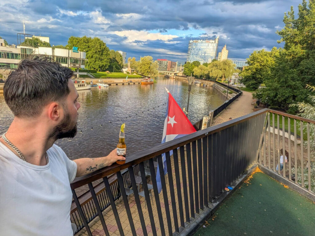 The author Thom Brown, enjoying a bottle of Corona and lime on the roof of Väike Kuuba