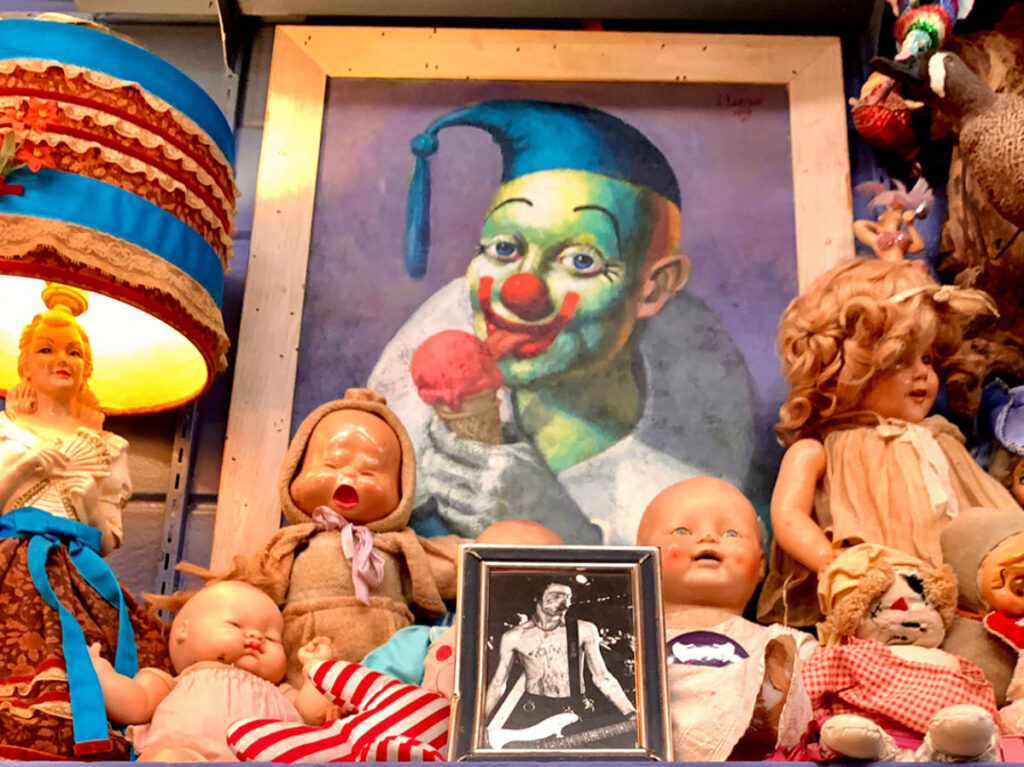 Unique dolls and paintings being sold at a thrift store in Austin