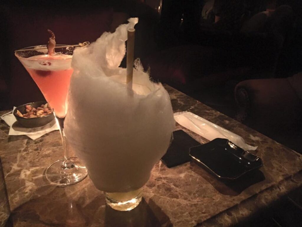 A glass of the cotton candy cocktail served at Tir Na Nog