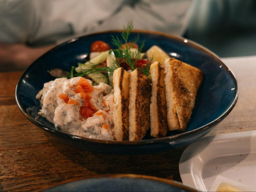 A bowl with Toast Skagen at Restaurant Kajsas Fisk