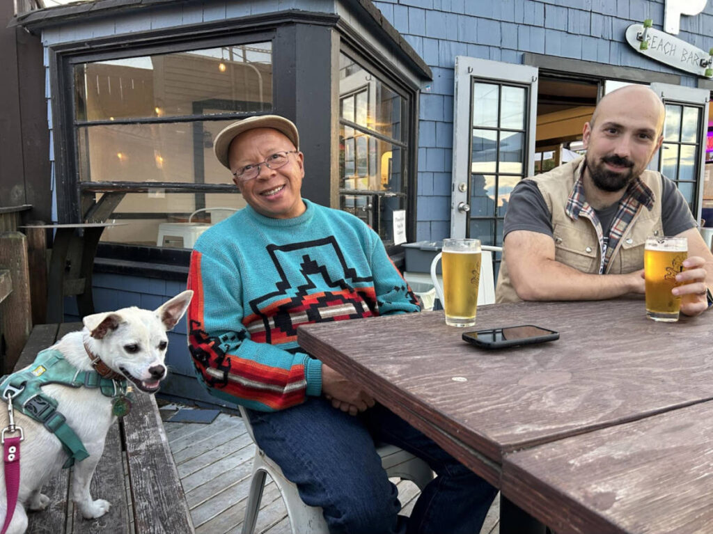 The author's dad, and her husband with their dog, Toby at a brewery