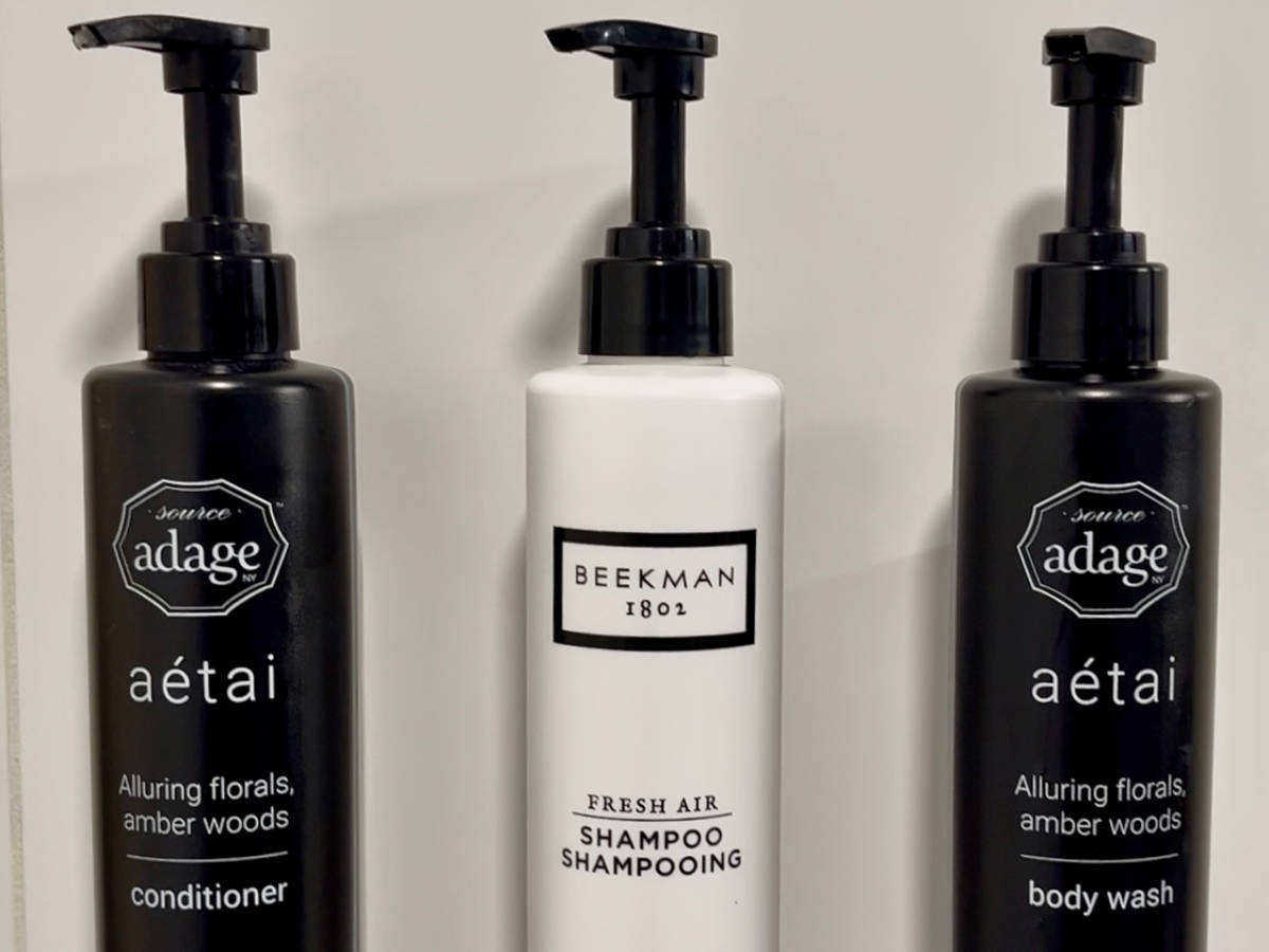 Bottles of Source Adage and Beekman on a bathroom in a room in Blue Horizon Hotel