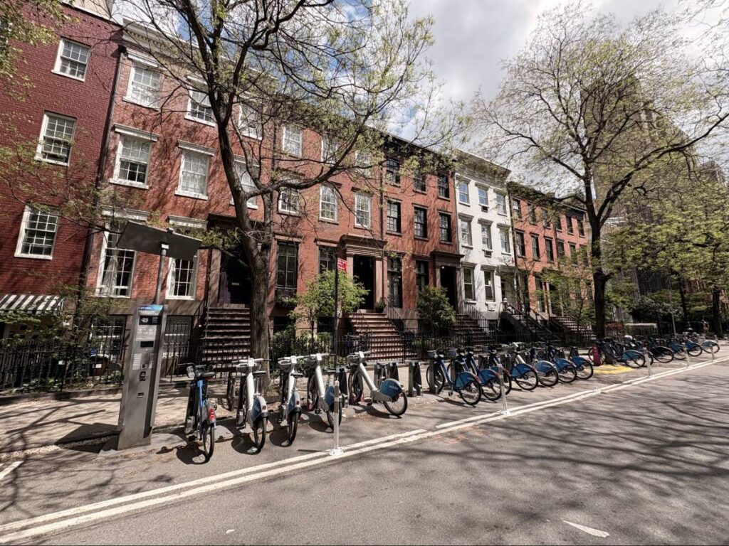 Row of brownstones and bicycles across from Tompkins Square Park