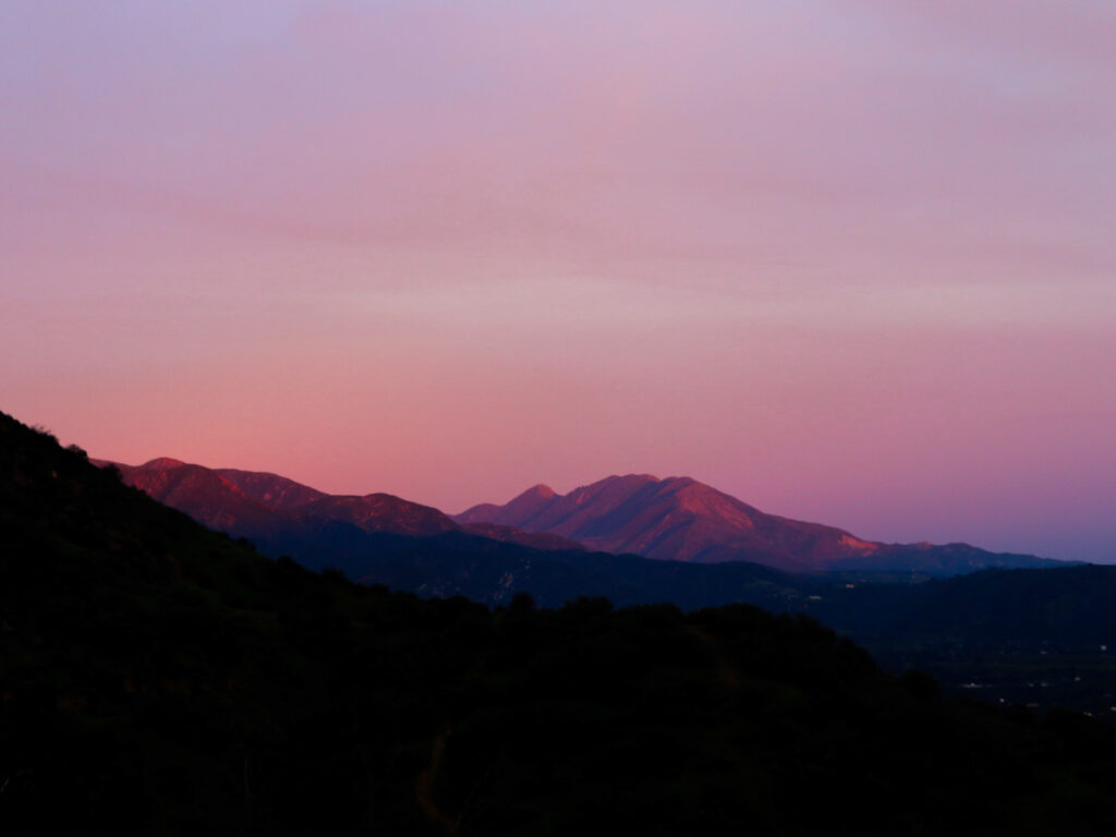 View of Topa Topa Mountains and Ojai Valley Pink Moment at dusk overlooking hill trails