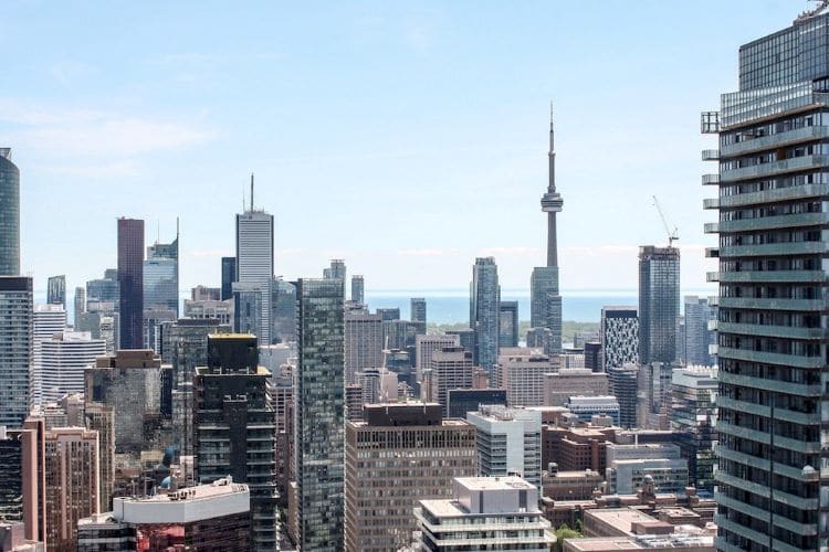 Overlooking view of the Toronto skyline facing out onto the water with the CN tower