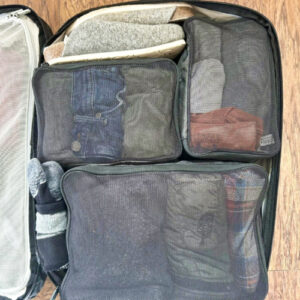 The Tortuga Packing Cubes on the luggage