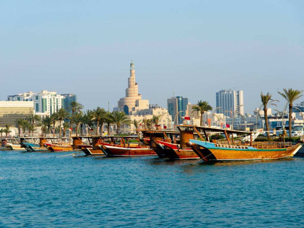 Clear sky over traditional dhow boats