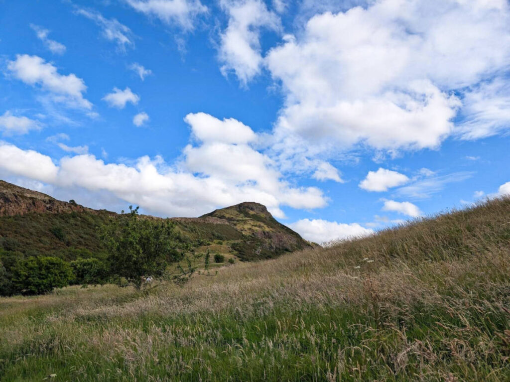 View of the vast greenfield trail to Arthur’s Seat