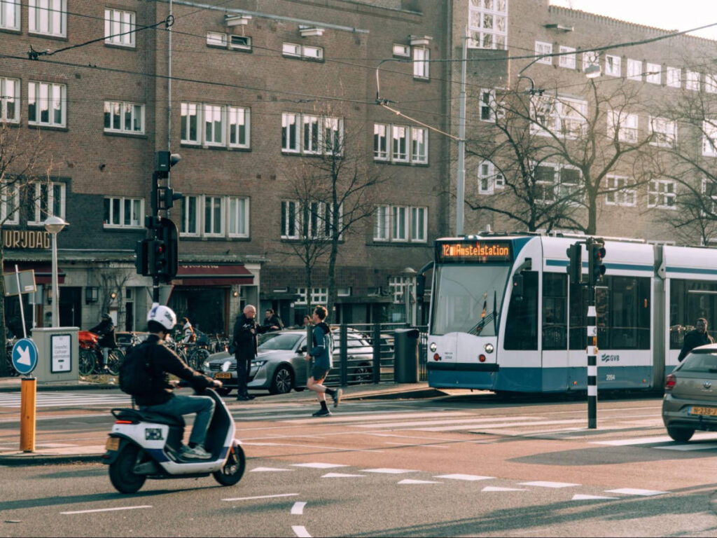 View of the tram and the various vehicles in Amsterdam