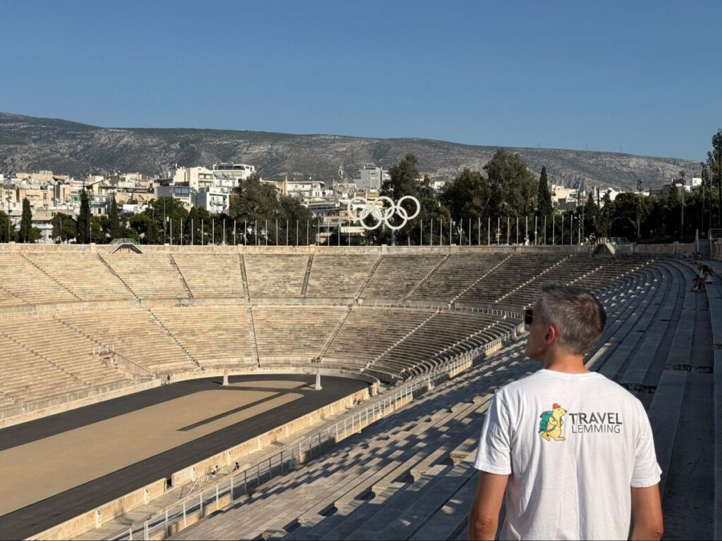 Travel Lemming’s founder Nate looking out over the Panathenaic Stadium from its highest steps