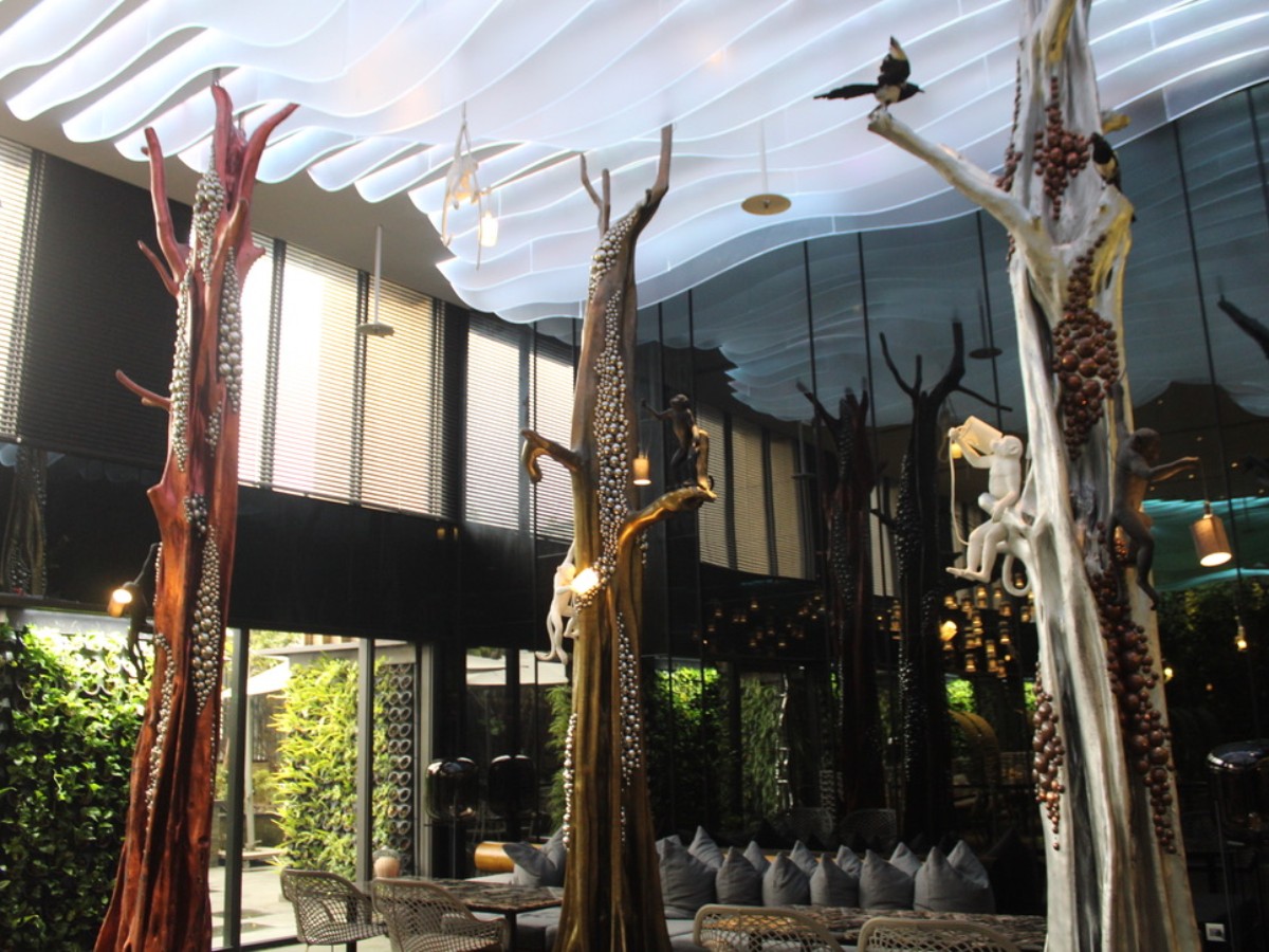Wide view of the Tree sculptures at arTree Hotel